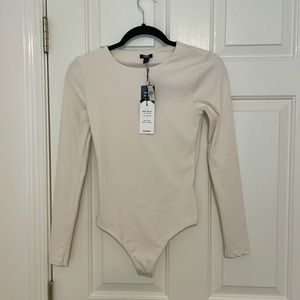 Express body contour cream long sleeve thong bodysuit